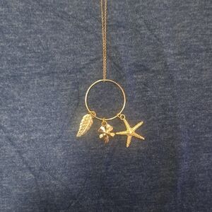 Elegant Gold Necklace with Leaf, Flower, and Starfish Charms
